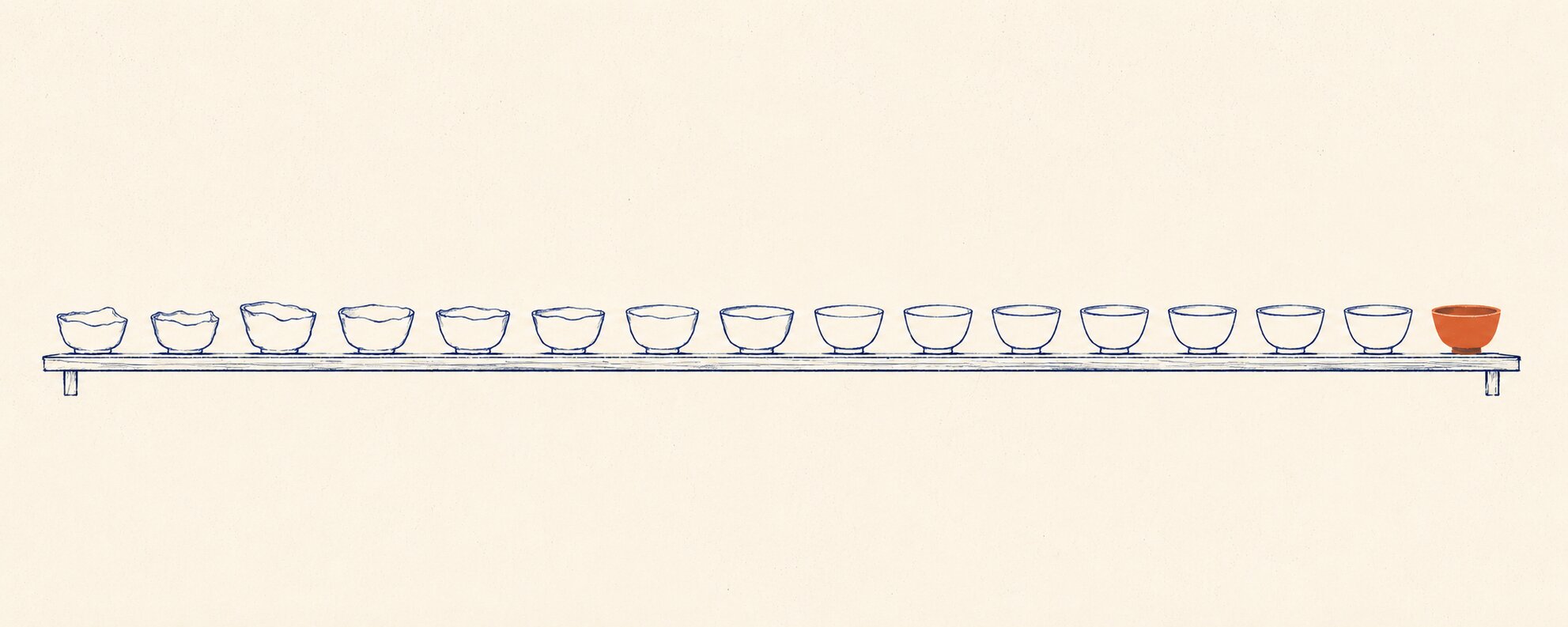 A long studio shelf of hand-thrown bowls in faint outline, each truer than the one before, the final bowl solid terracotta